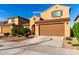 Charming home with a two-car garage, tile roof, and desert landscaping at 25627 N 163Rd Dr, Surprise, AZ 85387