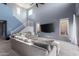 Spacious living room with high ceilings, large windows, and modern decor providing an open, airy feel at 25627 N 163Rd Dr, Surprise, AZ 85387