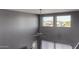 Living room featuring vaulted ceilings and three windows at 25627 N 163Rd Dr, Surprise, AZ 85387