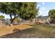 Expansive backyard featuring a pool, hot tub, lush tree, and well-maintained landscaping at 2616 E Des Moines St, Mesa, AZ 85213