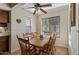 Cozy dining area featuring a wooden table set and natural light from two windows at 2616 E Des Moines St, Mesa, AZ 85213