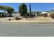 Charming single-story home with a well-maintained front yard and mature trees at 2616 E Des Moines St, Mesa, AZ 85213