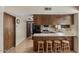 Functional kitchen with breakfast bar and view into the eat in dining area at 2616 E Des Moines St, Mesa, AZ 85213