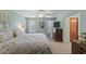 Bright bedroom showcasing a ceiling fan, coordinated decor, and comfortable furnishings at 2616 E Des Moines St, Mesa, AZ 85213
