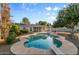 Large pool and spa are surrounded by lush landscaping, providing the perfect setting for outdoor enjoyment at 2616 E Des Moines St, Mesa, AZ 85213