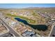 Expansive aerial view featuring a picturesque lake, golf course, and houses nestled within a scenic desert community at 26689 W Ponderosa Ln, Buckeye, AZ 85396