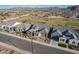 Aerial shot of well-manicured homes with desert landscaping, nestled in a community with mountain views at 26689 W Ponderosa Ln, Buckeye, AZ 85396