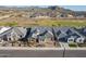 Wide aerial shot showing homes with desert landscaping, and distant mountains in the background at 26689 W Ponderosa Ln, Buckeye, AZ 85396