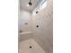 Luxurious shower with a built-in bench and dual shower heads at 26689 W Ponderosa Ln, Buckeye, AZ 85396