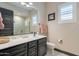 Bathroom featuring a vanity with a sink, a toilet, and a mirror at 26689 W Ponderosa Ln, Buckeye, AZ 85396