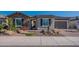 Attractive home exterior with stone accents, well-maintained landscaping, and a welcoming entrance at 26689 W Ponderosa Ln, Buckeye, AZ 85396