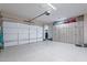 Spacious three car garage features epoxy flooring and wood-look cabinets at 26689 W Ponderosa Ln, Buckeye, AZ 85396