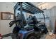 Garage features a golf cart and built in cabinets, providing ample storage space at 26689 W Ponderosa Ln, Buckeye, AZ 85396