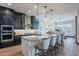 Modern kitchen showcases granite countertops, stainless steel appliances, and a large center island with bar seating at 26689 W Ponderosa Ln, Buckeye, AZ 85396