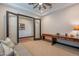 Office with desk, sofa, french doors and ceiling fan at 26689 W Ponderosa Ln, Buckeye, AZ 85396