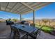 Back patio featuring a dining area with seating for six, perfect for outdoor gatherings at 26689 W Ponderosa Ln, Buckeye, AZ 85396