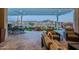 Spacious patio offers comfortable seating with water feature and fire pit views for luxurious outdoor enjoyment at 26689 W Ponderosa Ln, Buckeye, AZ 85396