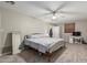 Bright bedroom with a ceiling fan, carpeted floors, and a full-length mirror for added convenience at 2726 E Hale St, Mesa, AZ 85213