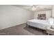 Spacious bedroom featuring soft carpet, white walls, and a ceiling fan for a bright and airy feel at 2726 E Hale St, Mesa, AZ 85213
