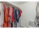 Walk-in closet featuring a wooden rod for hanging clothes and shelving for folded items at 2726 E Hale St, Mesa, AZ 85213