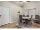 Bright dining room features a round table, seating for four, and a door leading to the exterior at 2726 E Hale St, Mesa, AZ 85213
