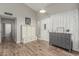 Inviting entryway with wood-look flooring, coat rack, and natural light at 2726 E Hale St, Mesa, AZ 85213