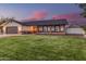 Charming single-story home featuring a well-manicured lawn, brick accents, and a two-car garage at 2726 E Hale St, Mesa, AZ 85213