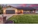 Charming single-story home featuring a well-manicured lawn, brick accents, and a two-car garage at 2726 E Hale St, Mesa, AZ 85213
