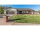 Charming single-Gathering home featuring a well-maintained lawn, brick accents, and a welcoming entrance at 2726 E Hale St, Mesa, AZ 85213