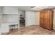 Kitchen features a built-in desk area, a large wooden armoire, and yellow curtains accenting the windows at 2726 E Hale St, Mesa, AZ 85213