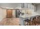 Spacious kitchen with stainless steel appliances, breakfast bar, ample counter space, and natural light at 2726 E Hale St, Mesa, AZ 85213