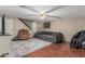 Inviting living room showcasing hardwood floors, a sectional sofa, and access to the staircase at 2726 E Hale St, Mesa, AZ 85213