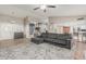 Spacious living room featuring an accent wall, plush sectional sofa and stylish rug, perfect for relaxation at 2726 E Hale St, Mesa, AZ 85213