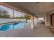 Inviting pool area featuring a covered patio, lush landscaping, and ample seating at 2726 E Hale St, Mesa, AZ 85213