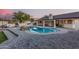 Beautiful backyard pool area with a built-in barbecue and outdoor dining space at 2726 E Hale St, Mesa, AZ 85213