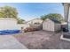 Backyard shed and wood pile, adding extra storage and a rustic touch to this property at 2726 E Hale St, Mesa, AZ 85213