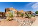 Attractive desert-landscaped front yard with native plants and rock features creating curb appeal at 29193 N Mountain View Rd, San Tan Valley, AZ 85143