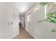 Light and airy hallway with wood floors, leading to the living areas of the home at 29193 N Mountain View Rd, San Tan Valley, AZ 85143