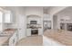 The kitchen features white cabinets, stainless steel appliances and an island with a granite counter top at 29193 N Mountain View Rd, San Tan Valley, AZ 85143