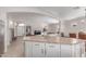 Open concept kitchen with granite counter tops island with seating and an open view to the living room at 29193 N Mountain View Rd, San Tan Valley, AZ 85143
