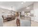 Kitchen includes a granite counter top island with bar seating that transitions to the dining room table at 29193 N Mountain View Rd, San Tan Valley, AZ 85143