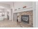 Living room with stone fireplace, mantel, and open access to the kitchen at 29193 N Mountain View Rd, San Tan Valley, AZ 85143