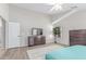 The bright main bedroom includes a ceiling fan, large windows, and a television at 29193 N Mountain View Rd, San Tan Valley, AZ 85143