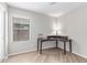 Home office featuring a dark wood desk and a bright window with blinds at 29193 N Mountain View Rd, San Tan Valley, AZ 85143