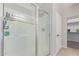 Bright bathroom featuring a glass enclosed shower and door to walk-in closet at 29193 N Mountain View Rd, San Tan Valley, AZ 85143
