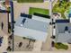 This aerial view showcases a well-kept backyard with a lush lawn, brick patio, and a neutral-toned roof at 3138 N 82Nd Pl, Scottsdale, AZ 85251