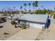 Aerial view of property showing desert landscaping, grey tile roof, and spacious driveway at 3138 N 82Nd Pl, Scottsdale, AZ 85251