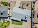 This aerial view highlights a manicured backyard featuring a green lawn, gray roof, and outdoor living space at 3138 N 82Nd Pl, Scottsdale, AZ 85251