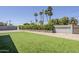 This backyard features a meticulously maintained green lawn and a neatly landscaped perimeter, perfect for outdoor enjoyment at 3138 N 82Nd Pl, Scottsdale, AZ 85251