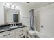 Bathroom featuring a white vanity, granite countertop, bathtub and shower at 3138 N 82Nd Pl, Scottsdale, AZ 85251